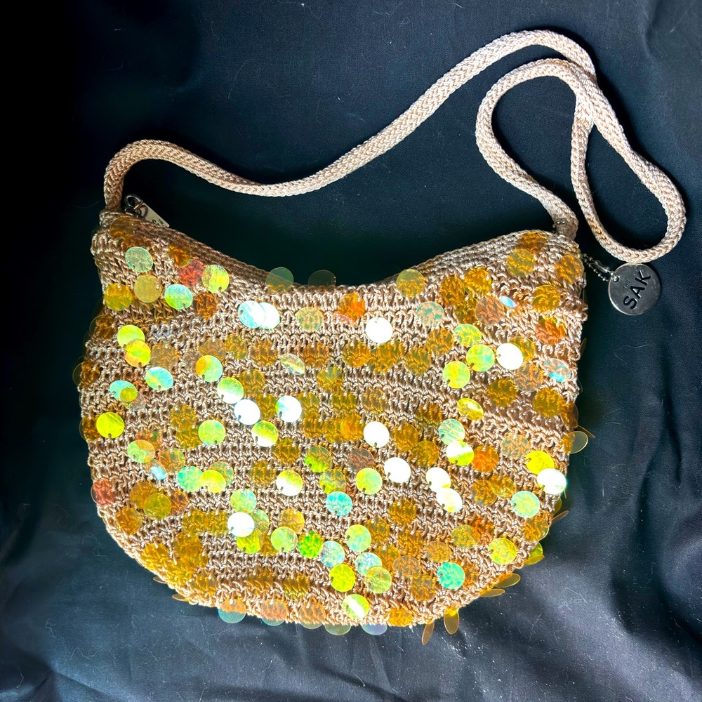 The Sak brand gold, boho & sequin mini handbag. No tag but Perfect condition!